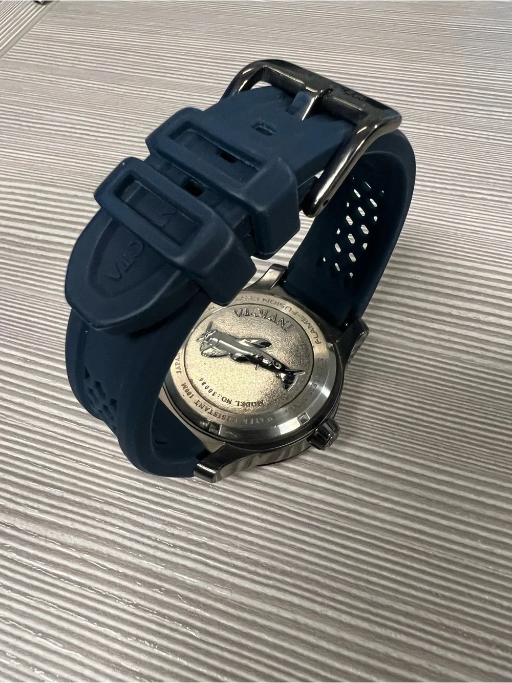Invicta Black Case Men’s Chronograph Watch with Blue Strap and Red Dial Accents